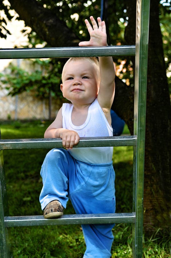 Boy climbing ladder