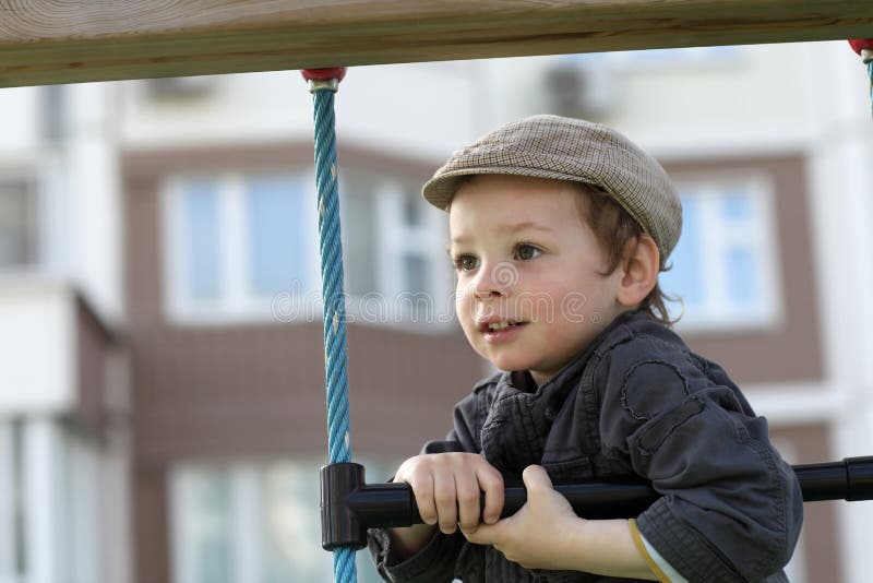 Boy on a rope ladder stock photo. Image of childhood 42304256