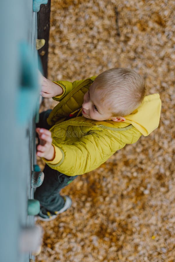 Boy at the Climbing Wall without a Helmet, Danger at the Climbing Wall