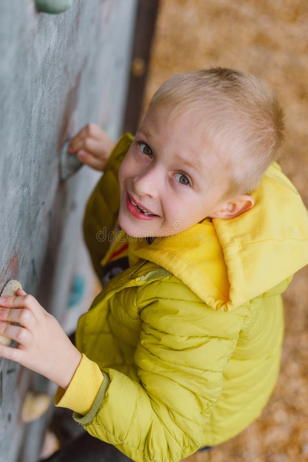 Boy at the Climbing Wall without a Helmet, Danger at the Climbing Wall