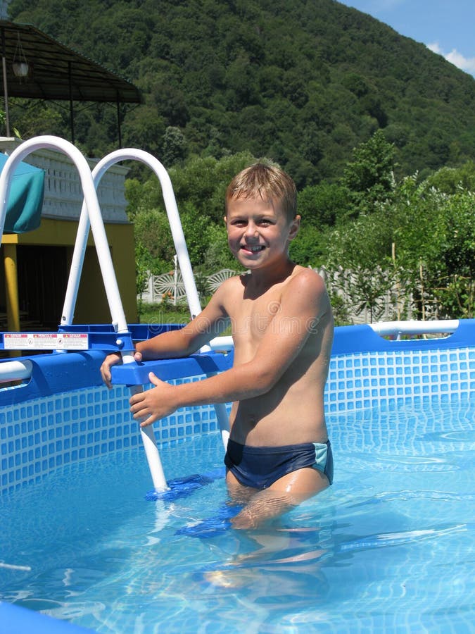 Boy in collapsible pool