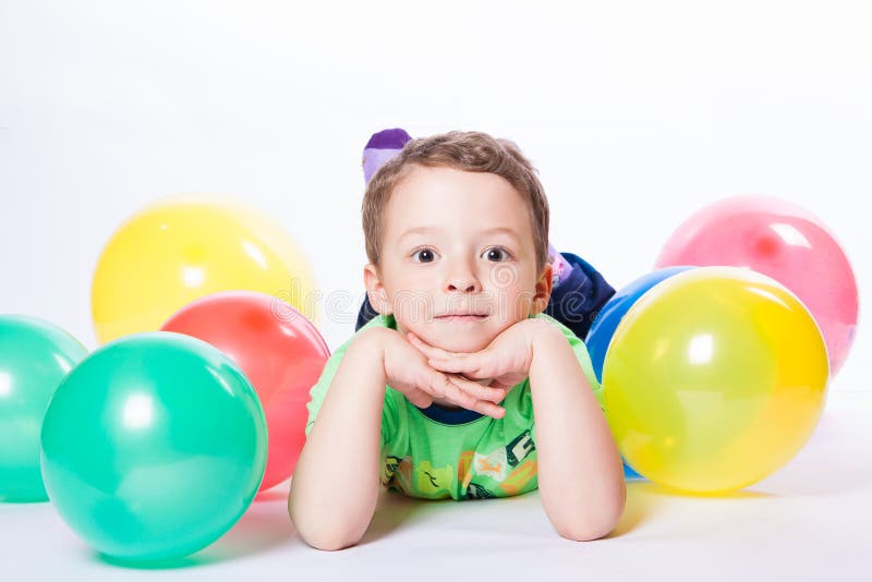Boy with colorful balloons stock photo. Image of birthday - 49945938