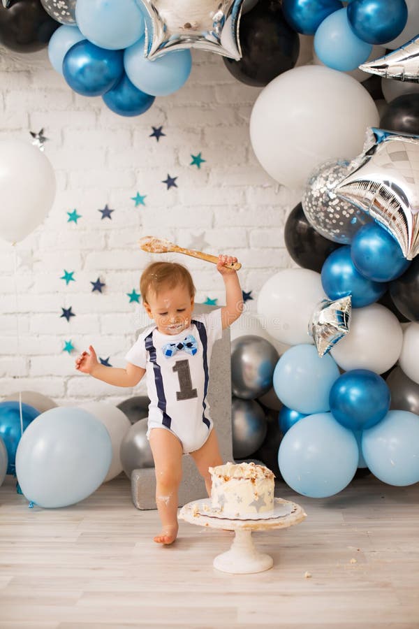 Boy crash first smash cake stock image