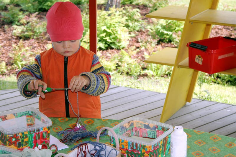 A Boy cutting cord