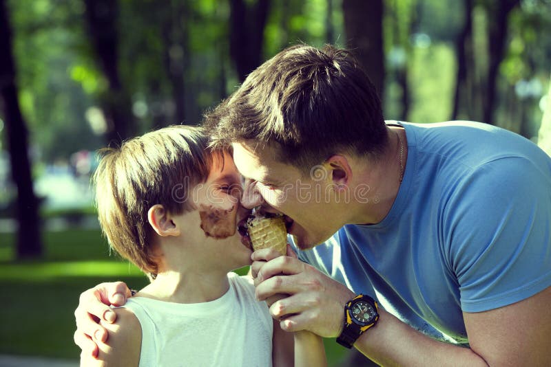 Boy and dad stock image. Image of leaves, park, healthy 76043603