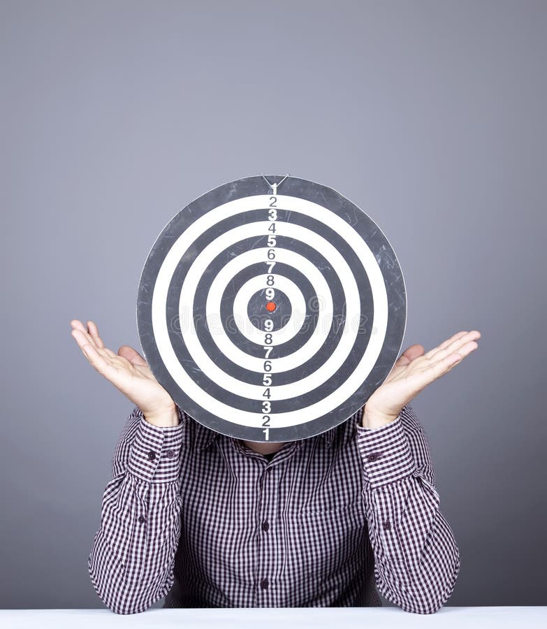 Boy with dartboard in place of head.