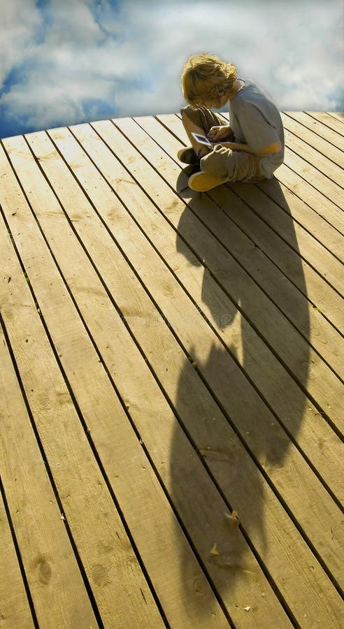 Boy on deck playing a game