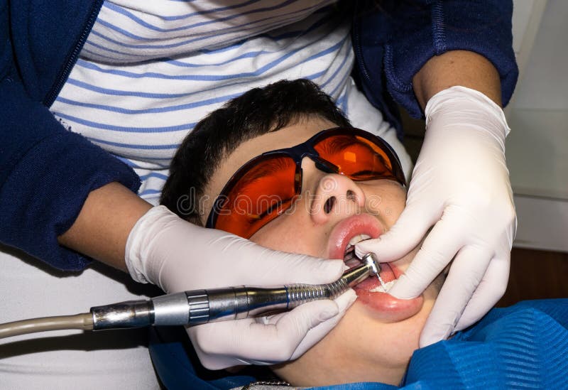 Autistic boy in dental treatment. brace. health care stock photography Autistic boy in dental treatment. brace. health care stock photography