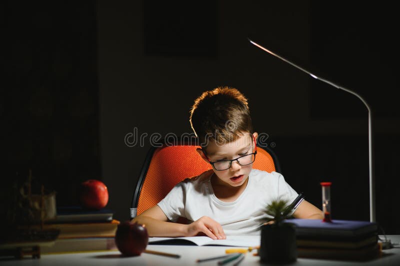 he does his homework in the evening