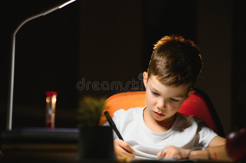 he does his homework in the evening