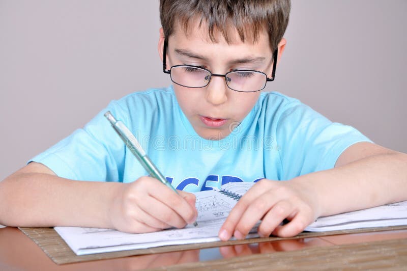 Boy doing homework stock image. Image of eraser, colour - 39364149