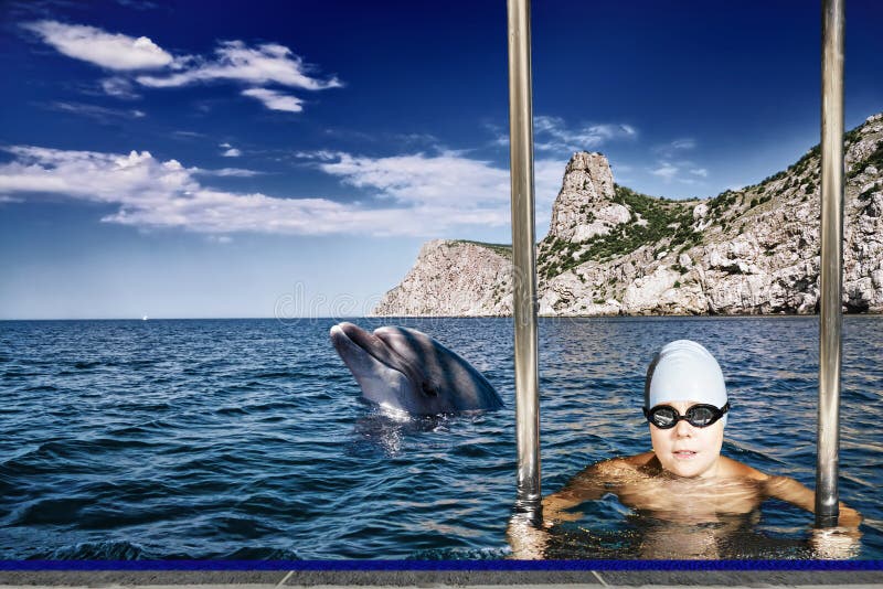 Boy and dolphin royalty free stock photography