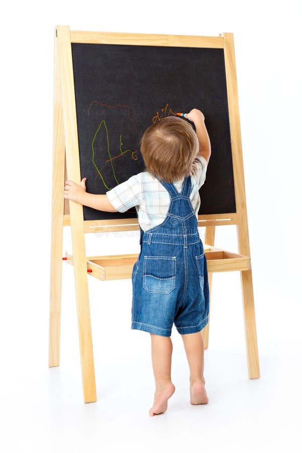 A boy is drawing on a blackboard