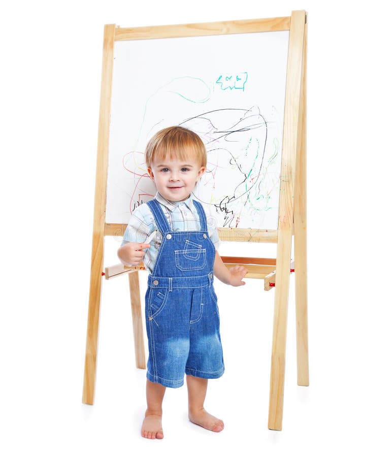 A boy is drawing on a blackboard