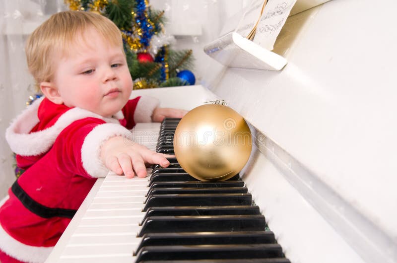 Boy dressed as Santa Claus