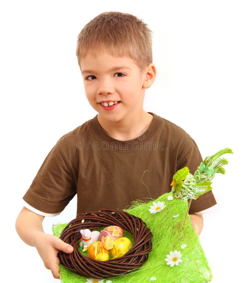 Boy and easter nest full of colorful eggs