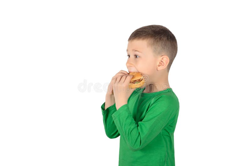 Boy eating burger stock photo. Image of cheerful, fastfood 145289356