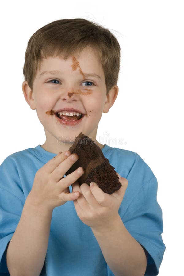 Boy Eating Cake stock image. Image of party