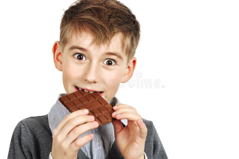 Boy Eating a chocolate stock photo. Image of expression 23080338