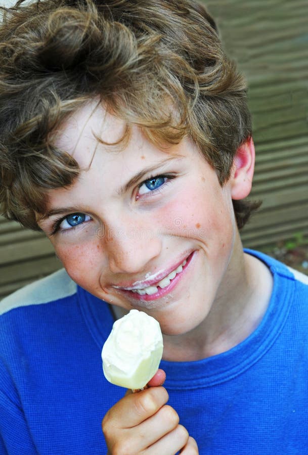 Boy eating icecream stock image. Image of naughty, mischief 7310939