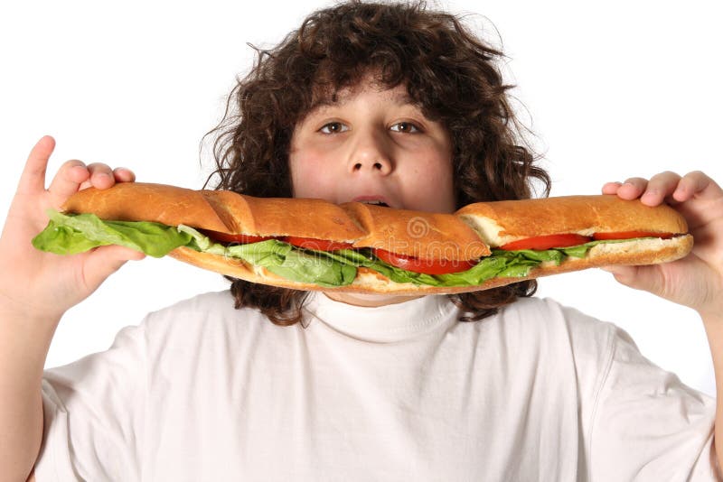 Boy eating large sandwich stock image. Image of pleasure 4695579