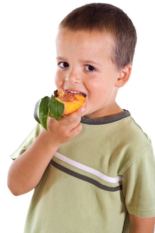 Boy eating peach stock image. Image of closeup, enjoy 6082093