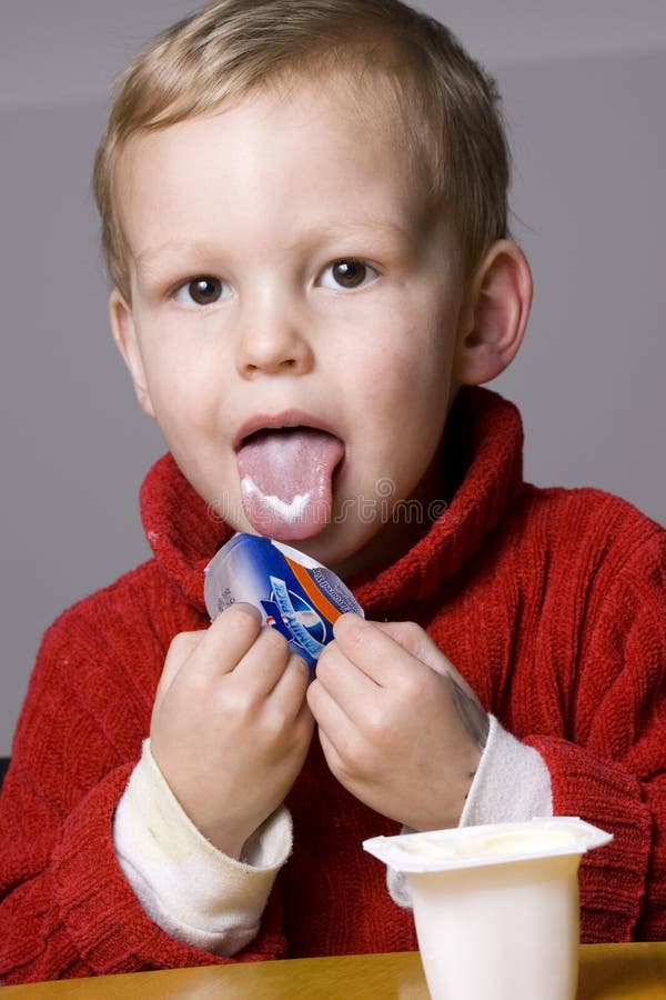 Boy eating yogurt stock photo. Image of healthy, diet 10756506