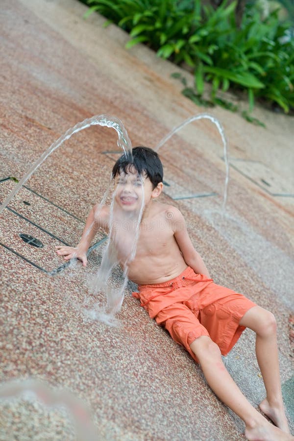 Boy Enjoying the Pool by the Fountain Stock Photo Image of trip