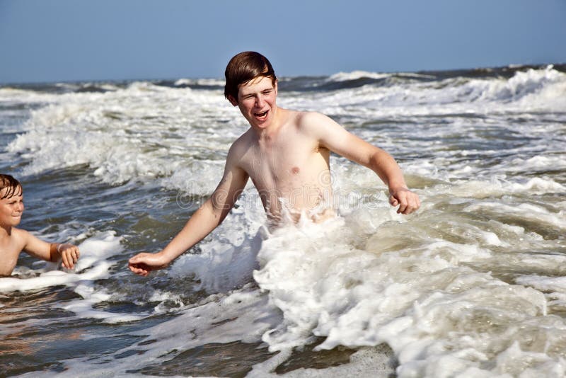 boy enjoys the waves