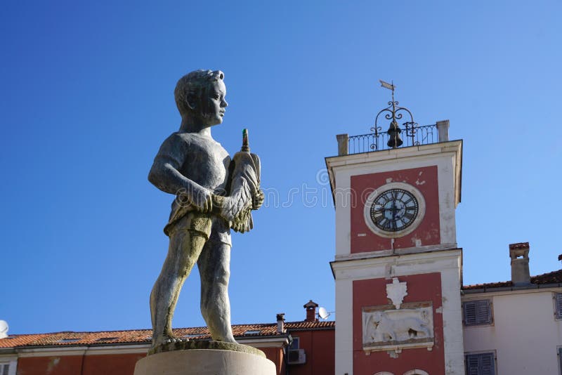 Boy with the fish Fountain on Main Square in Rovinj, Croatia