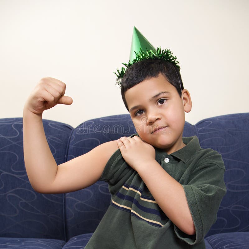 Boy flexing arm muscle. stock photo. Image of person, macho 2426094