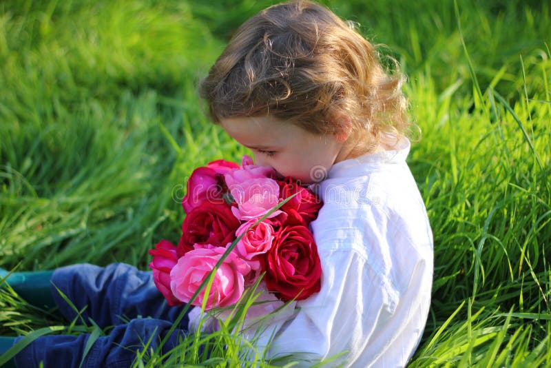 Boy with flowers stock photo. Image of little, floral 21714112