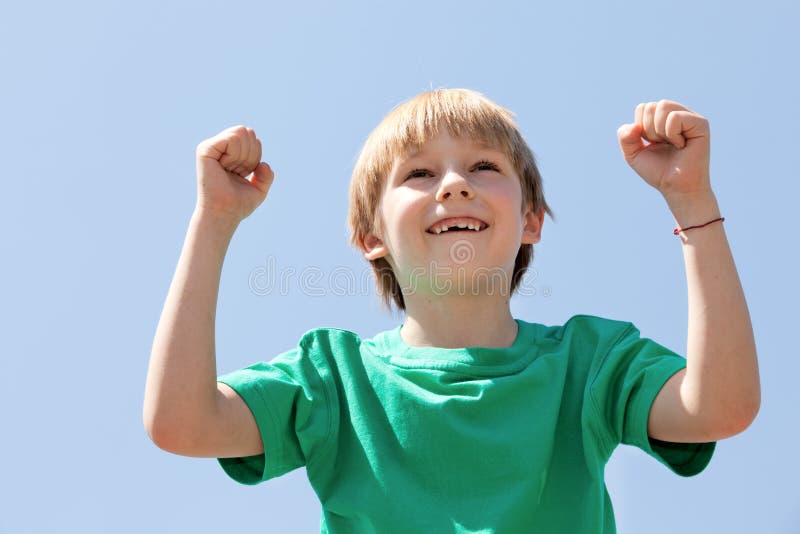 Boy football fan on sky background royalty free stock photography
