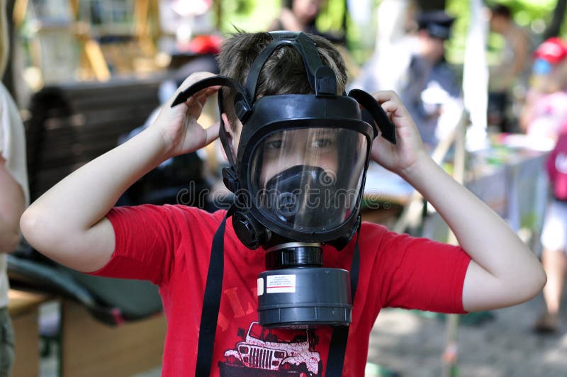 A boy in a gas mask stock image. Image of pollution, person 75385413