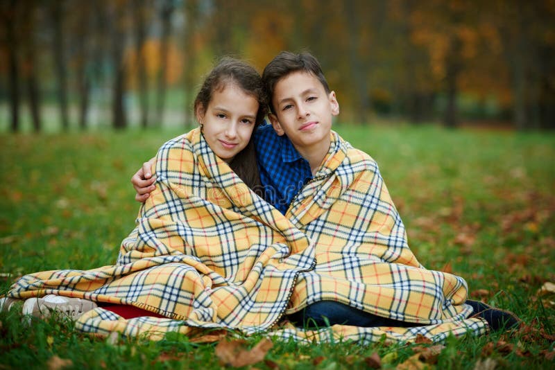 Boy and girl in autumn park stock photography Boy and girl in autumn park stock photography