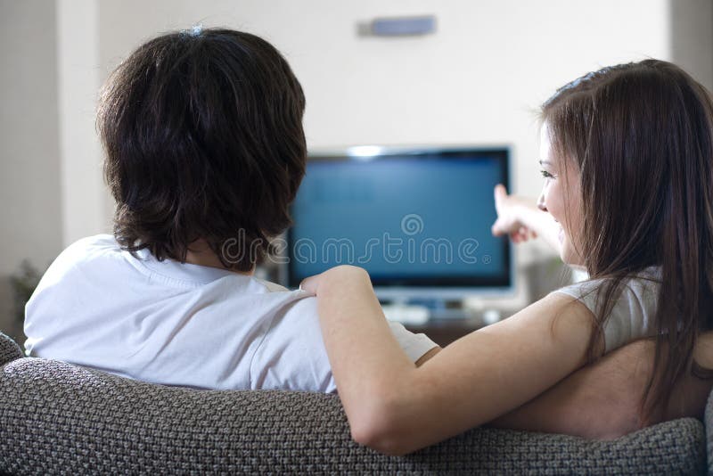 Boy with girl in front of TV