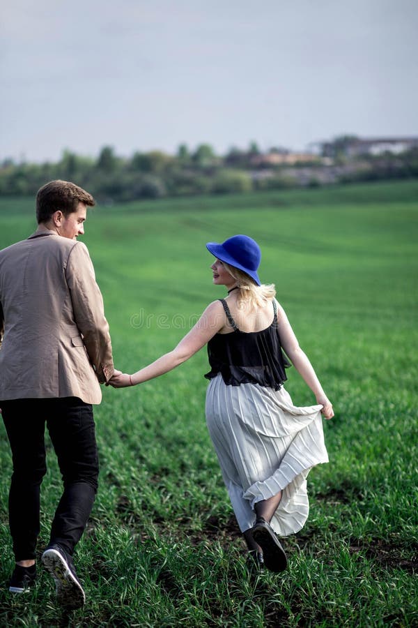 Boy and Girl Holding Hands and Running Outdoors Stock Photo Image of