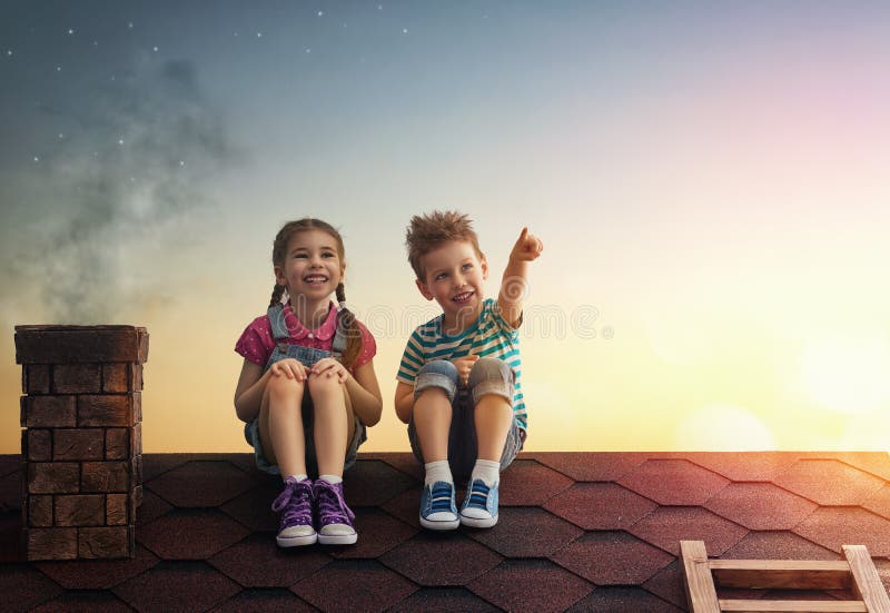 Boy and girl make a wish stock photo Boy and girl make a wish stock photo