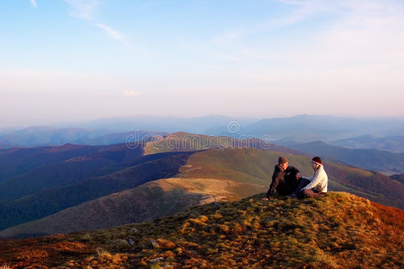 Boy and girl in the mountains