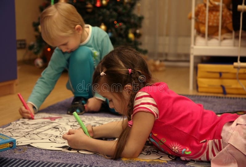 Boy and girl painting together