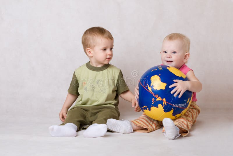 Boy and girl play with ball