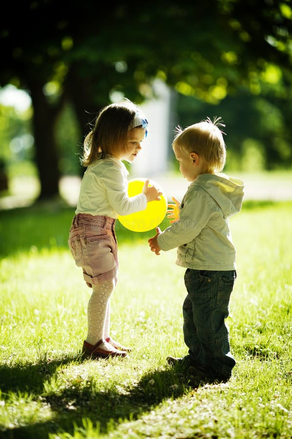 Boy and girl playing with ball