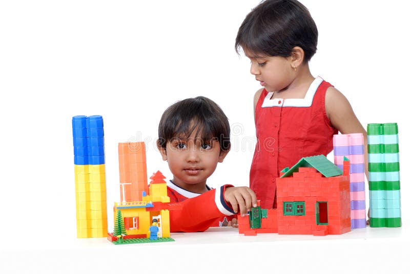 Boy and girl playing with blocks