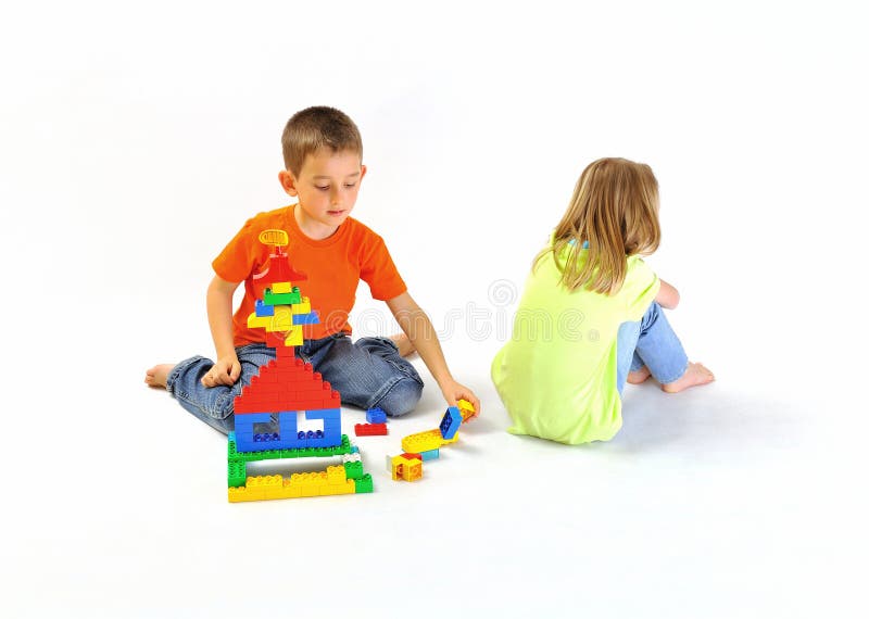 Boy and girl playing with a constructor