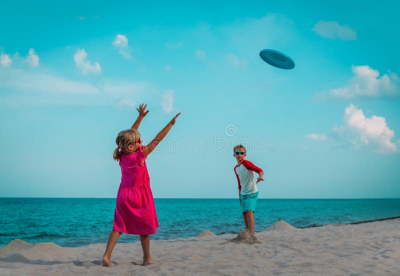 Father and Son Playing with Flying Disc at Beach Stock Image Image of coast, adult 43596629