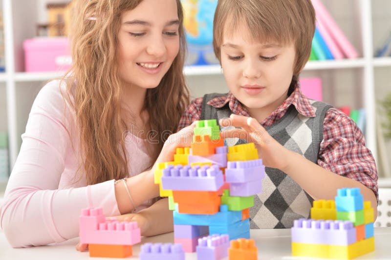 Boy and girl playing lego game