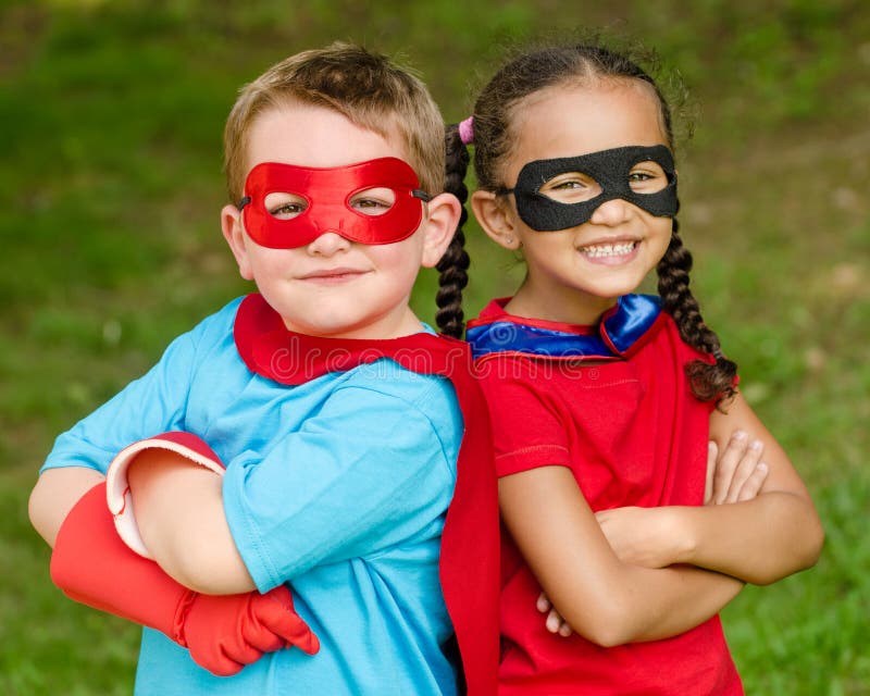 Boy and girl pretending to be superheroes