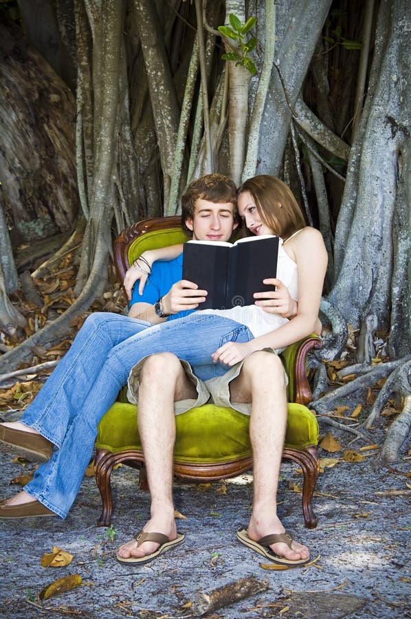 Boy and girl reading in chair