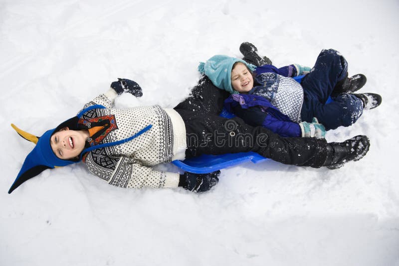 Boy and girl in snow.