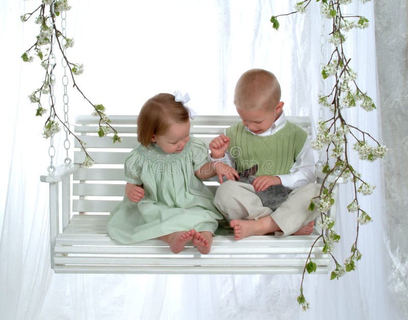 Boy and Girl on Swing with Bunny